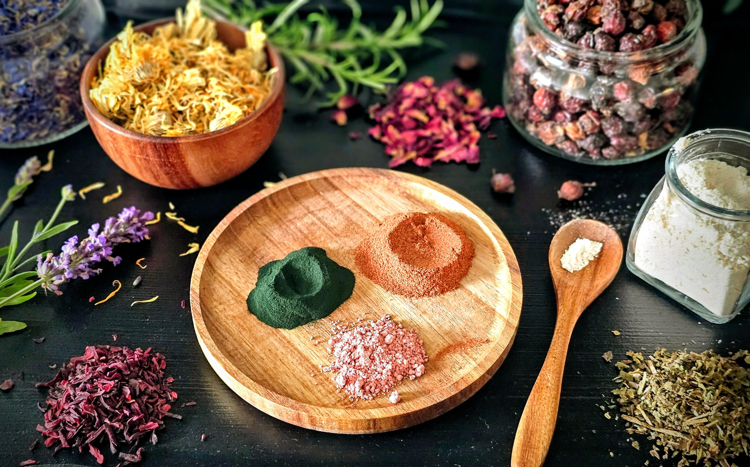 Natural botanicals and clay powders used in handmade soap collection.